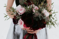 08 The bride was carrrying a matching bouquet with burgundy velvet ribbon