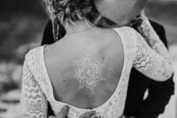 gorgeous henna tattoo on a bride’s back