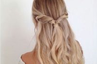 08 a twisted half updo with an accent braid and waves for a relaxed wedding