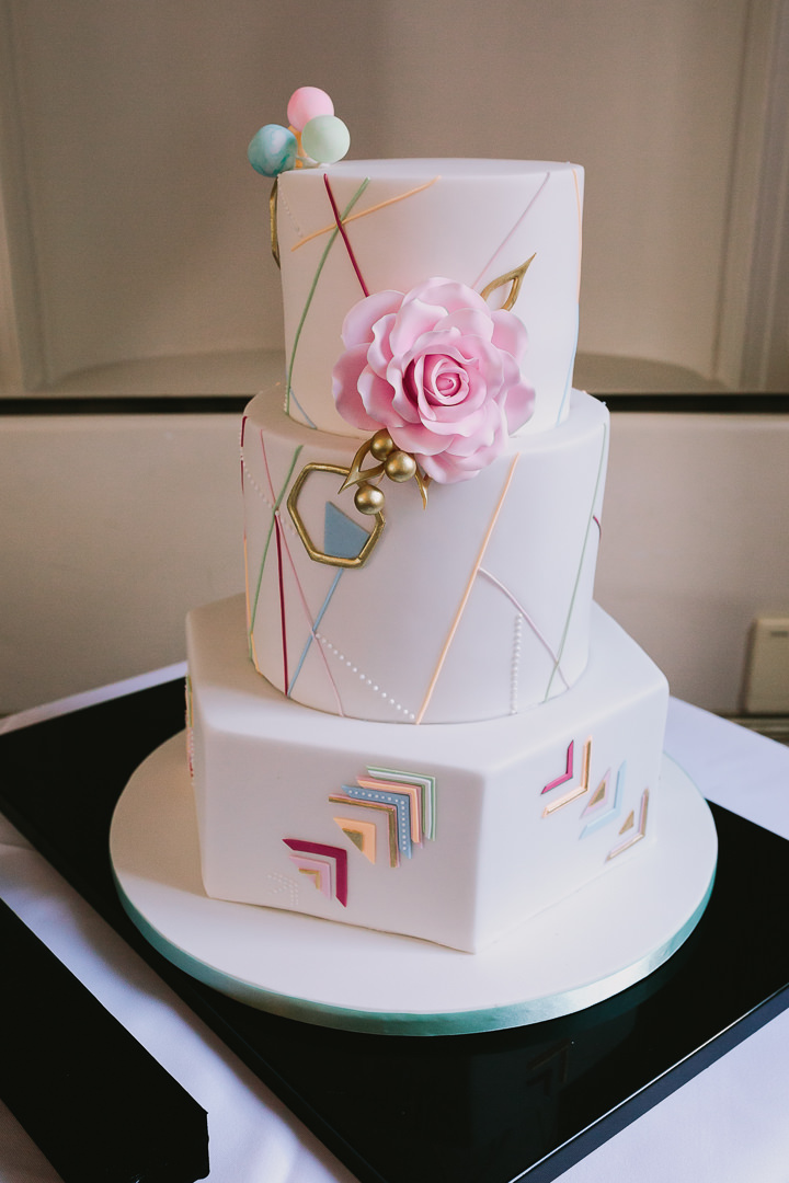 The wedding cake was a colorful geometric one, decorated with sugar flowers