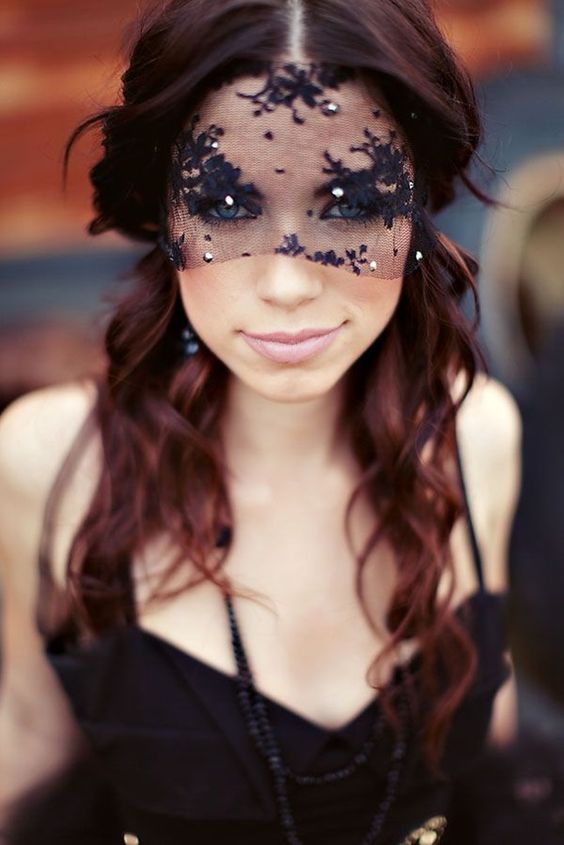 a small black lace veil with beads for a Halloween or dark romance bride