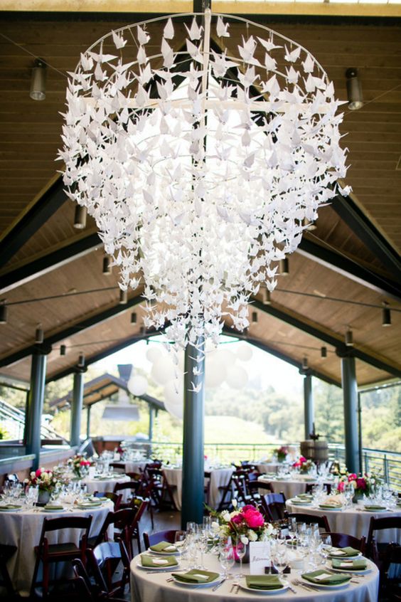 a stunning paper crane chandelier for decorating a wedding venue