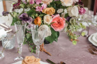 09 the tablescape was done with lush florals, exquisite glasses and cutlery plus a mauve tablecloth