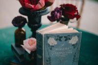 10 The wedding centerpieces were done with bold florals, vintage books and fruits