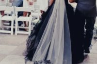 10 a black and white long veil with a train that matches the dress