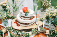 11 The wedding cake was a naked chocolate one topped with fresh berries and blooms