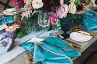 11 The wedding tablescape was done with blue and grey shades, very lush florals and geodes