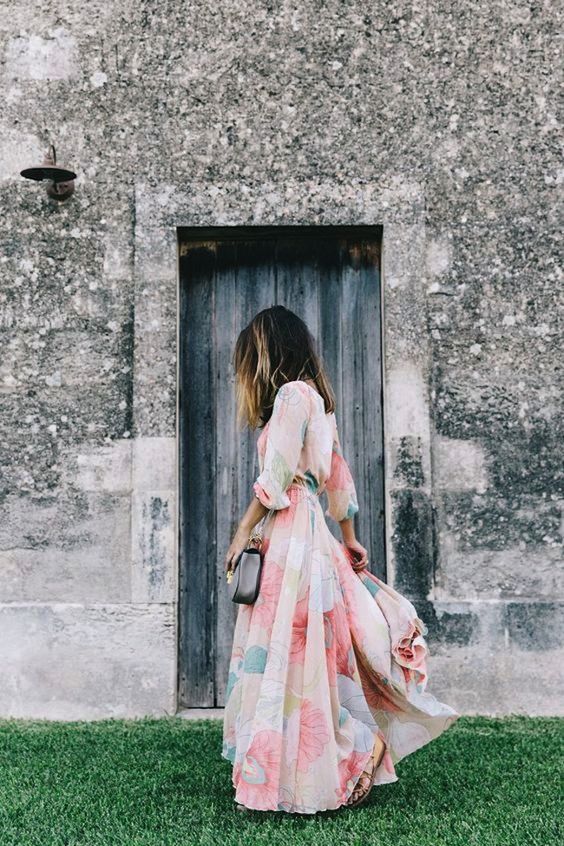 a pastel floral maxi dress with long sleeves and a grey clutch are ideal for spring