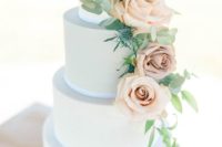 11 a powder blue wedding cake with gold leaf decor and blush roses and thistles is a very elegant choice