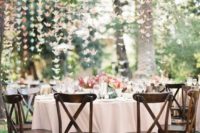 11 pastel origami crane garlands hanging over the whole reception for a cute look