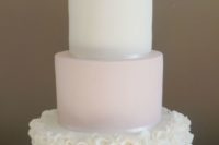 12 a blush and white wedding cake with ruffles on the white tier and on top