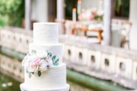 13 The wedding cake was a textural one, with lush blooms and greenery to fit the shoot theme
