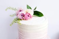 13 a soft ombre pink wedding cake with a texture and baby roses on top