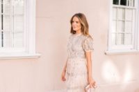 14 a girlish creamy dress with short puff sleeves, embellishments, embroidery, a blush cltuch and shoes