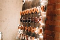 14 a wooden board donut wall decorated with LED lights for an industrial feel