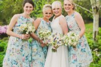 14 halter neckline knee blue bridesmaids’ dresses with floral prints and tulle underskirts for a retro feel