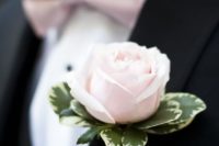 14 the groom in a black suit, a light pink bow tie and a matching boutonniere
