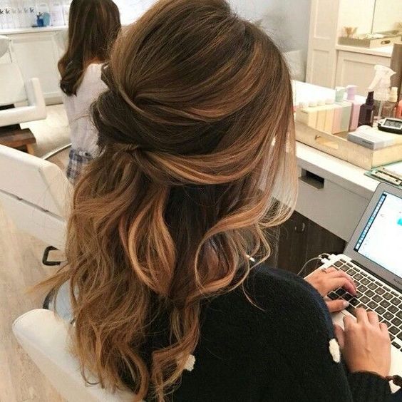 a twisted wavy half updo is a chic idea to try and is great for both long and medium length hair