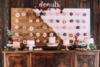 15 color block painted donut wall with calligraphy and some blooms on top