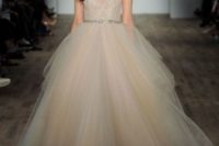 16 a champagne wedding ballgown with an embellished sparkling bodice on straps and a layered full skirt by Lazaro