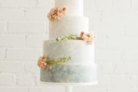 16 a grey watercolor wedding cake with an ombre effect and fresh peach-colored flowers for a wedding in subtle colors
