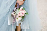 16 a light blue wedding dress and a pink wedding bouquet