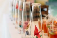 16 bottles with colorful paper cranes for decorating a drink bar or a station at your wedding