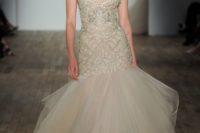 17 a champagne colored heavily embellished wedding dress with a tail and an embroidered bodice on straps by Lazaro