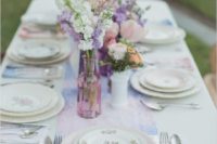 18 a watercolor wedding table runner in pink and blue with a lace trim and matching blooms
