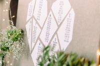 18 an origami-inspired heart seating chart is a trendy solution