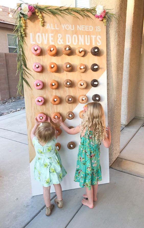 color block painted donut wall decorated with greenery and blooms