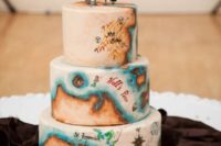 19 a pirate wedding cake with a vintage sea map and a skull topper