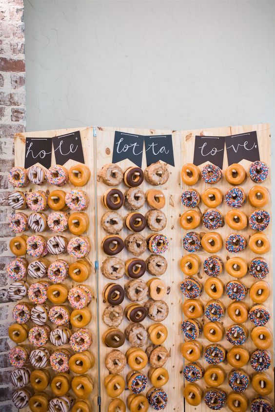 a simple chalkboard banner is all you need for decorating a donut wall