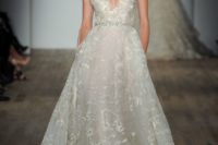 19 a sparkly floral print wedding gown with wide straps and a plunging neckline, an embellished belt by Lazaro