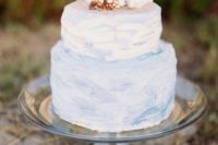 19 a subtle blue watercolor wedding cake with real corals on top is an ideal piece for a beach wedding