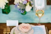 19 a watercolor place setting with a blue to green ombre watercolor menu and a matching napkin