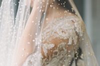 20 a bold pearly veil paired with a beaded dress for a super glam and formal wedding