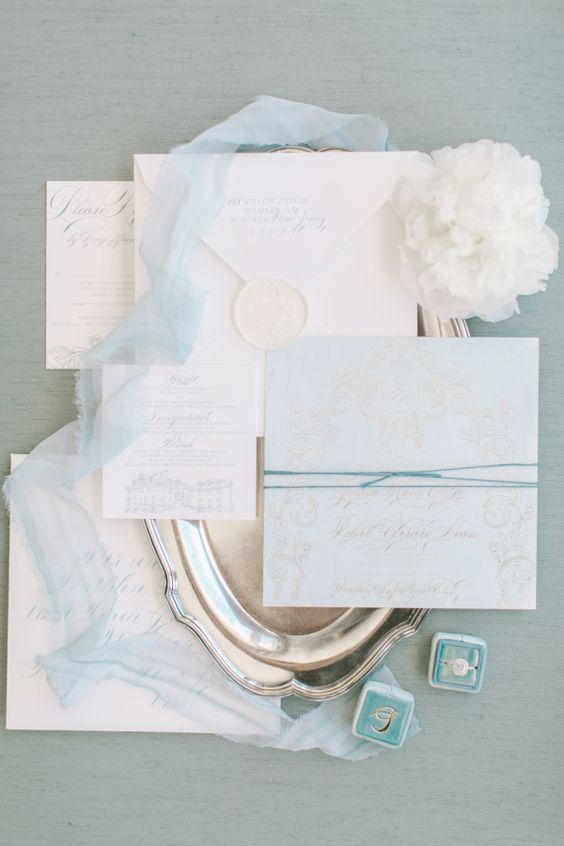 light blue and creamy wedding invitation suite with calligraphy looks vey romantic