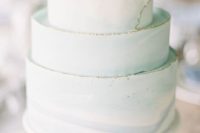 21 a light green wedding cake with a textural gold leaf egde is a very soft and tender idea