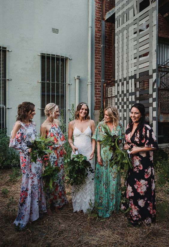 mismatched floral bridesmaids' dresses in green, lavender, black and white with bold floral prints