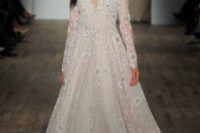 21 off the shoulder blush wedding dress with long sleeves and white floral lace applqies by Hayley Paige