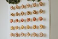 24 a Christmas donut wall with fir branches and a faux deer head