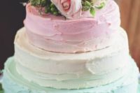 24 a pastel textural wedding cake with mint and pink tiers and fresh blooms on top