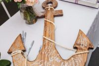 24 a wooden anchor is another great choice for an interesting guestbook