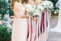 25 off the shoulder blush gowns with blush and cream bouquets and marsala ribbons