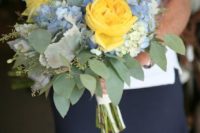 26 a bridal bouquet in bold yellow and light blue plus fresh greenery