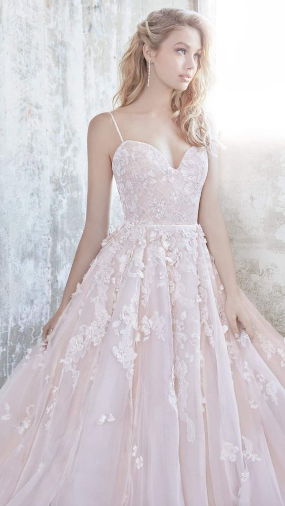 a spaghetti strap blush wedding ballgown with lace appliques by Hayley Paige