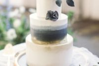 26 an elegant black, grey and white wedding cake with some watercolor and ombre plus black and white blooms
