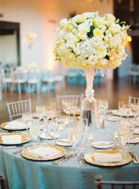 textural tablecloths, yellow blooms and chargers for an elegant formal wedding