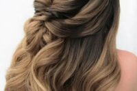 a beautiful dimensional wedding half updo with a bump on top and some waves down is a cool idea for a girl with long hair